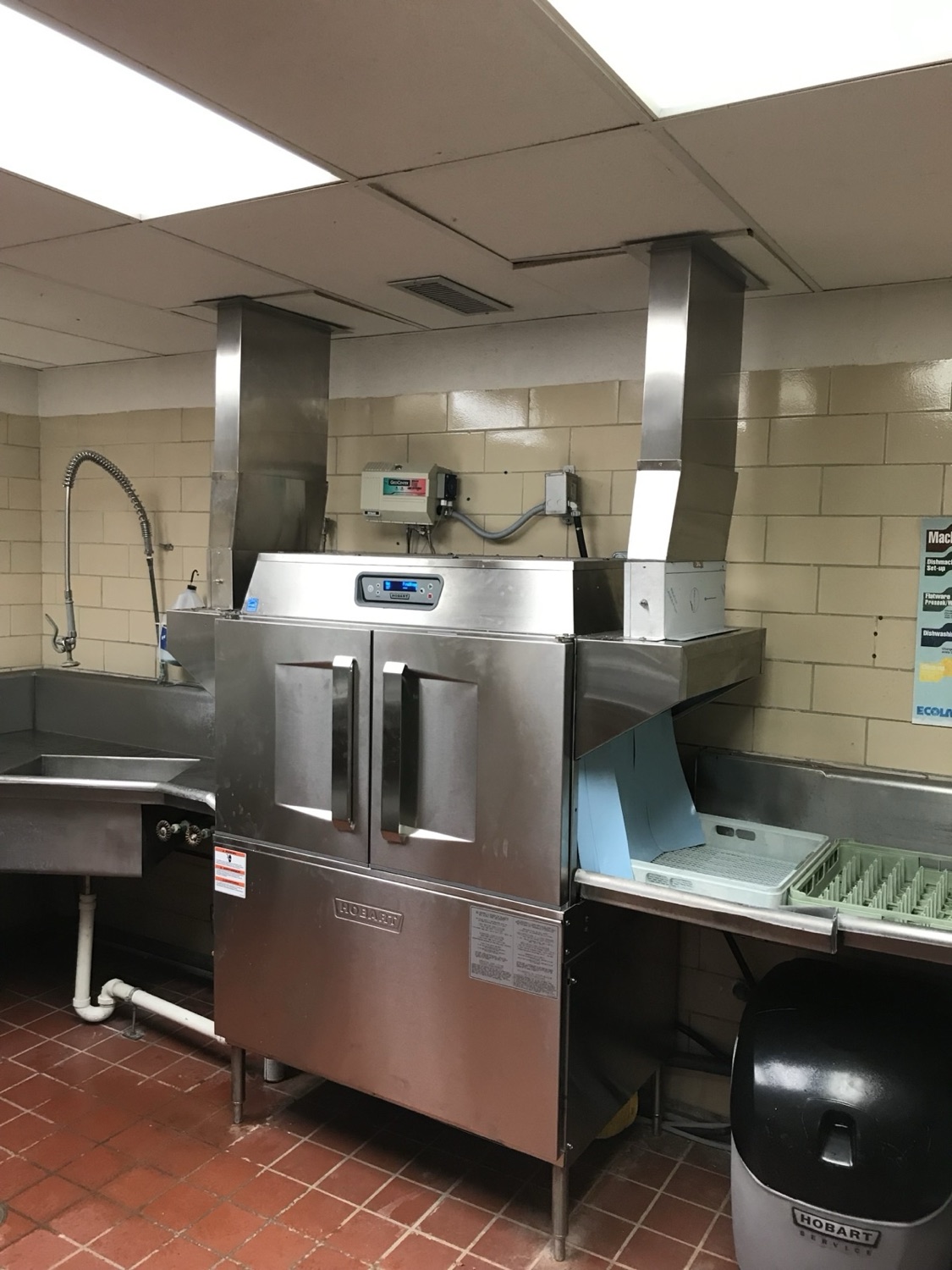 Stainless exhaust ductwork and dish station in a commercial kitchen